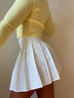 White pleated skirt